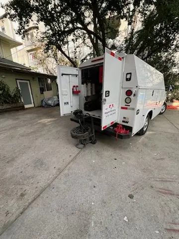 Magnet Plumbing service vehicle on-site for Grease Trap Cleaning in Boca Teeca